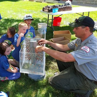 Trinidad Lake park ranger Kyle Sisco explains to students how the dam at Trinidad was built during the the annual water festival held at Trinidad State College, May 17-18, 2022.