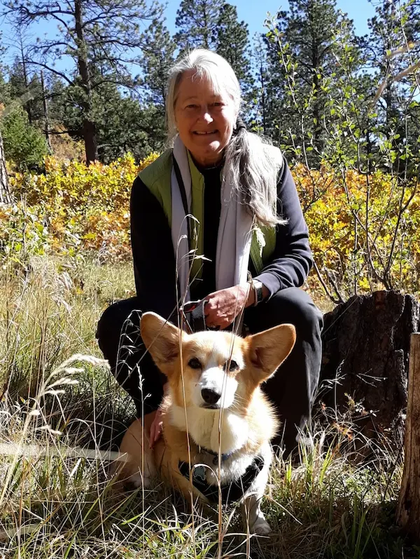Linda Perry with dog Gizmo in nature