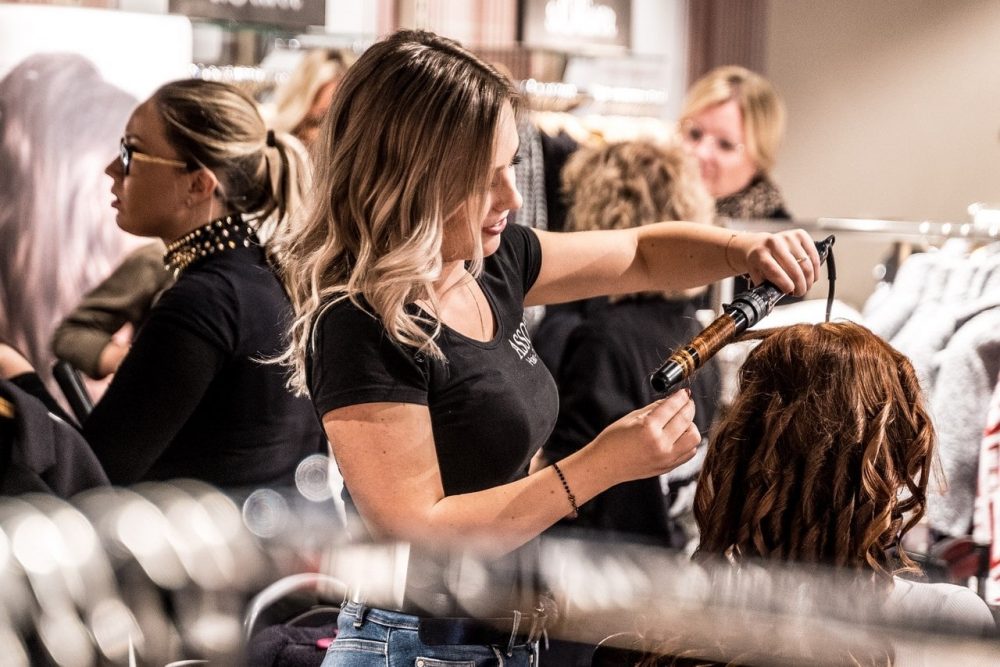 Woman curling hair image